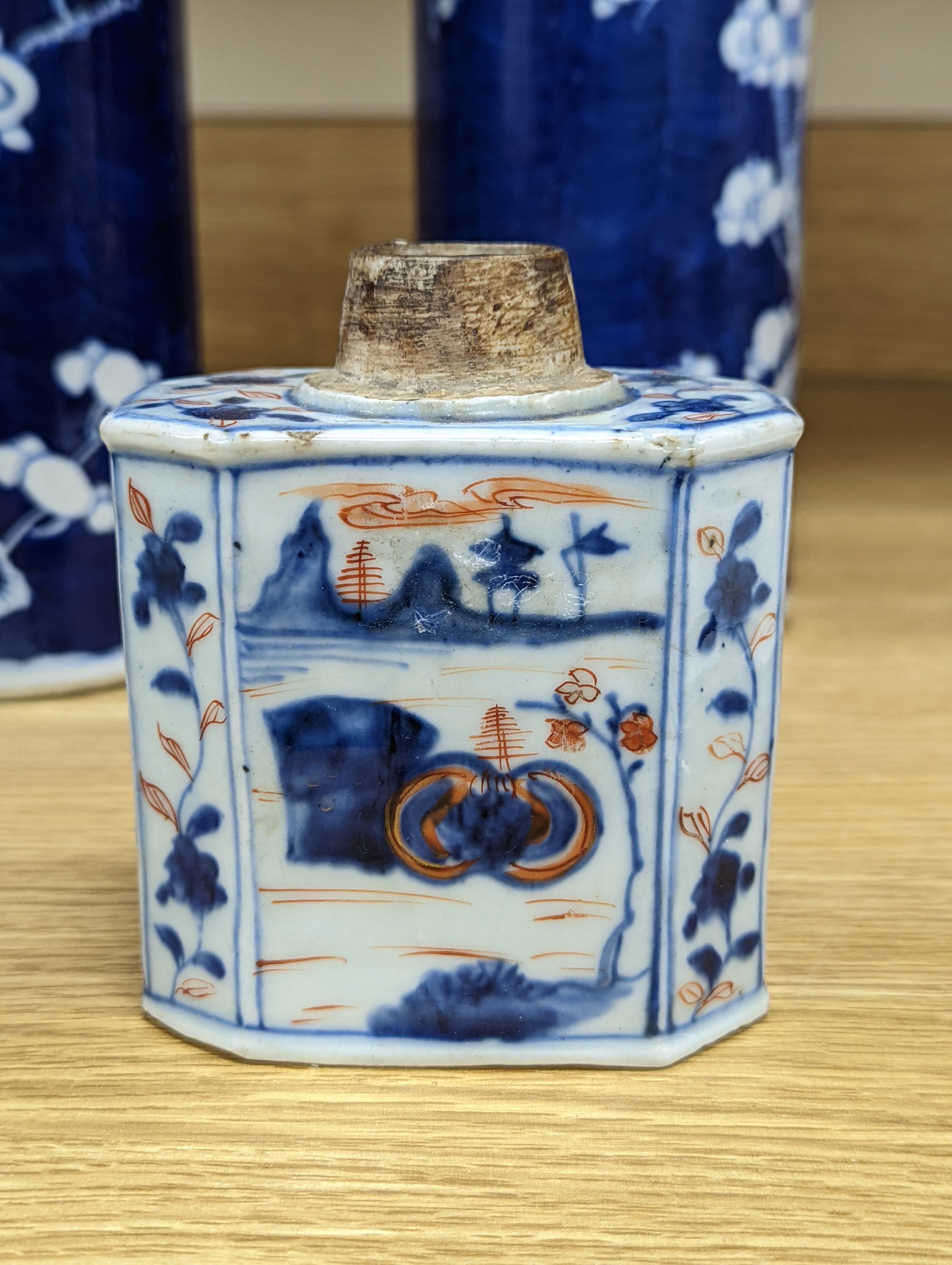 An 18th century Chinese famille rose mug, a Chinese Imari tea caddy and two Chinese blue and white sleeve vases 30cm (4)